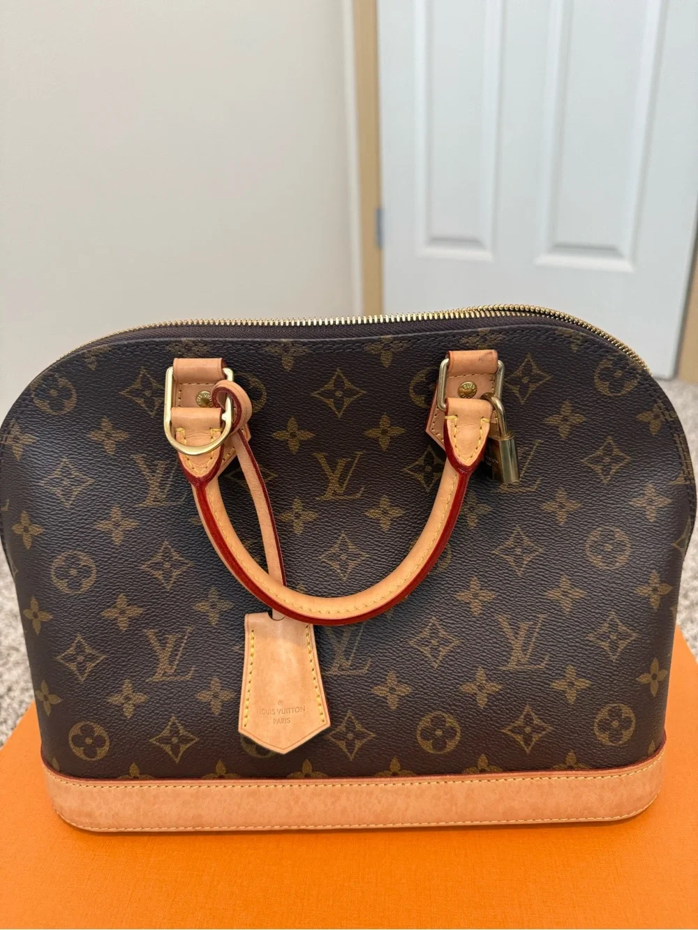 Louis Vuitton Monogram Alma Handbag in Brown and Tan